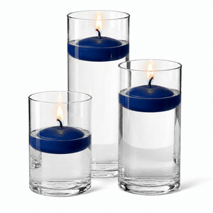 11 of 14: Cylinder Vase Centerpiece & Richland 3" Floating Candles Set of 18