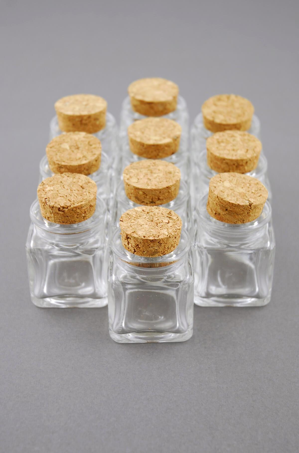 https://www.save-on-crafts.com/cdn/shop/products/mini-glass-bottle-square-with-cork-1_1200x.jpg?v=1689101995