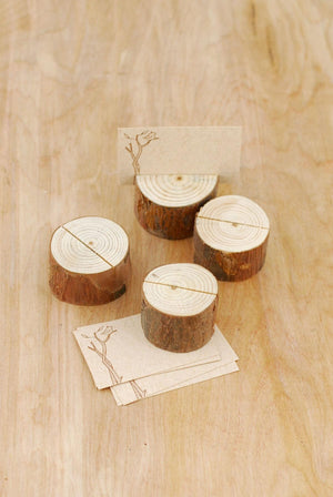 4 tree branch place card holders with cards